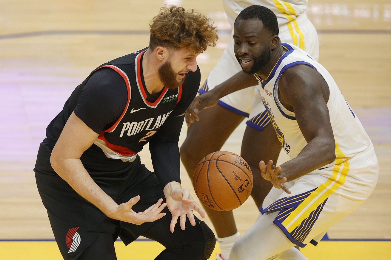 Draymond Green and Jusuf Nurkic battling for a loose ball