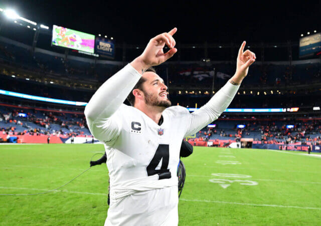 Nov 20, 2022; Denver, Colorado, USA; Las Vegas Raiders quarterback Derek Carr (4) celebrates the overtime win over the Denver Broncos at Empower Field at Mile High. Mandatory Credit: Ron Chenoy-USA TODAY Sports Derek Carr, Raiders