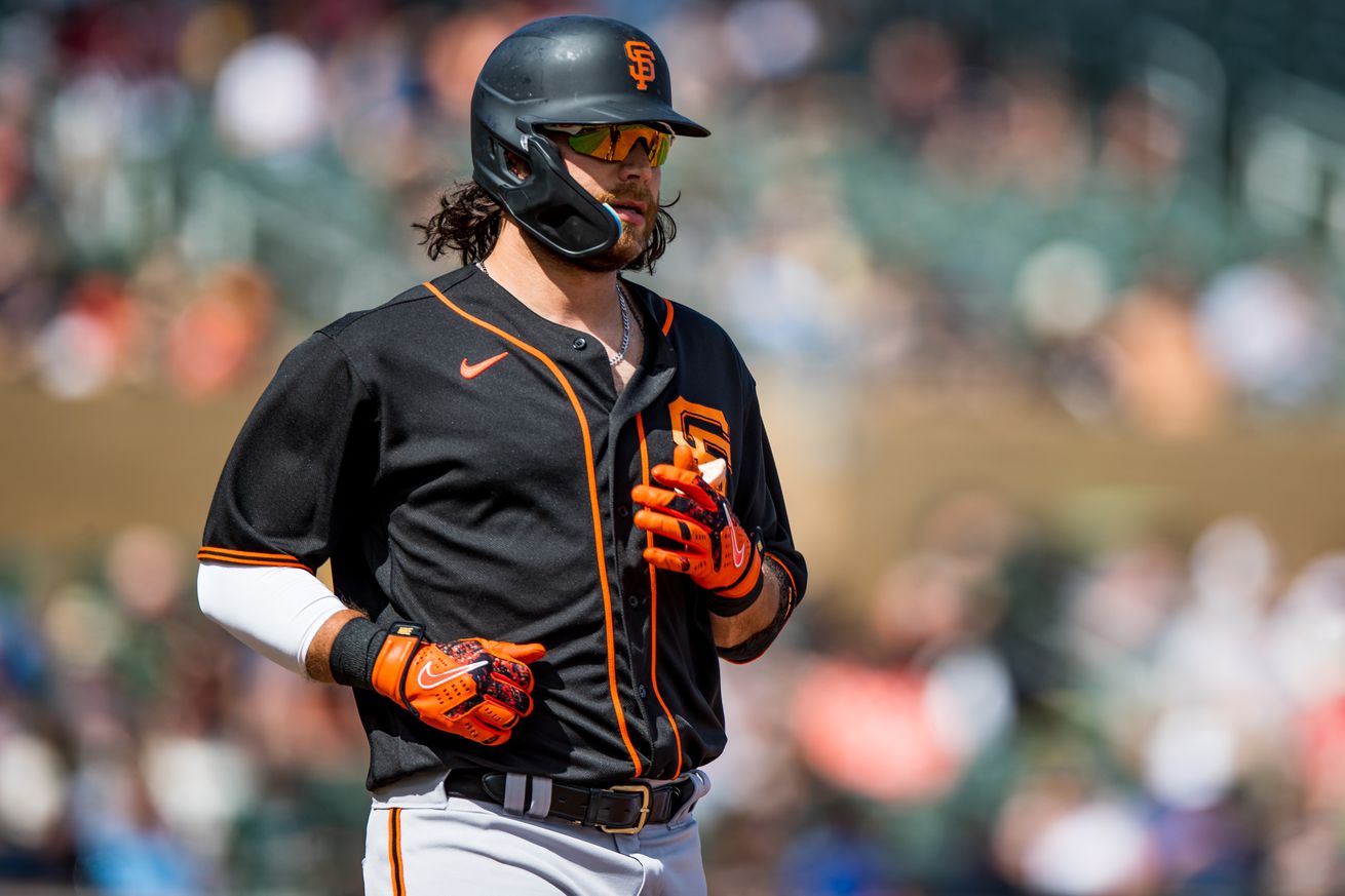 Brandon Crawford wearing a batting helmet and sunglasses