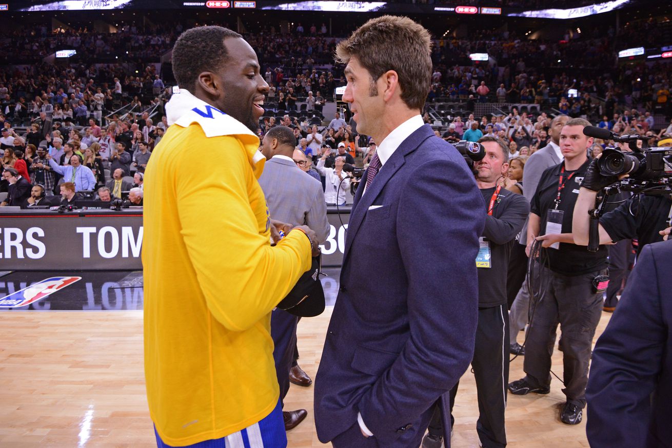 Bob Myers laughing with Draymond Green