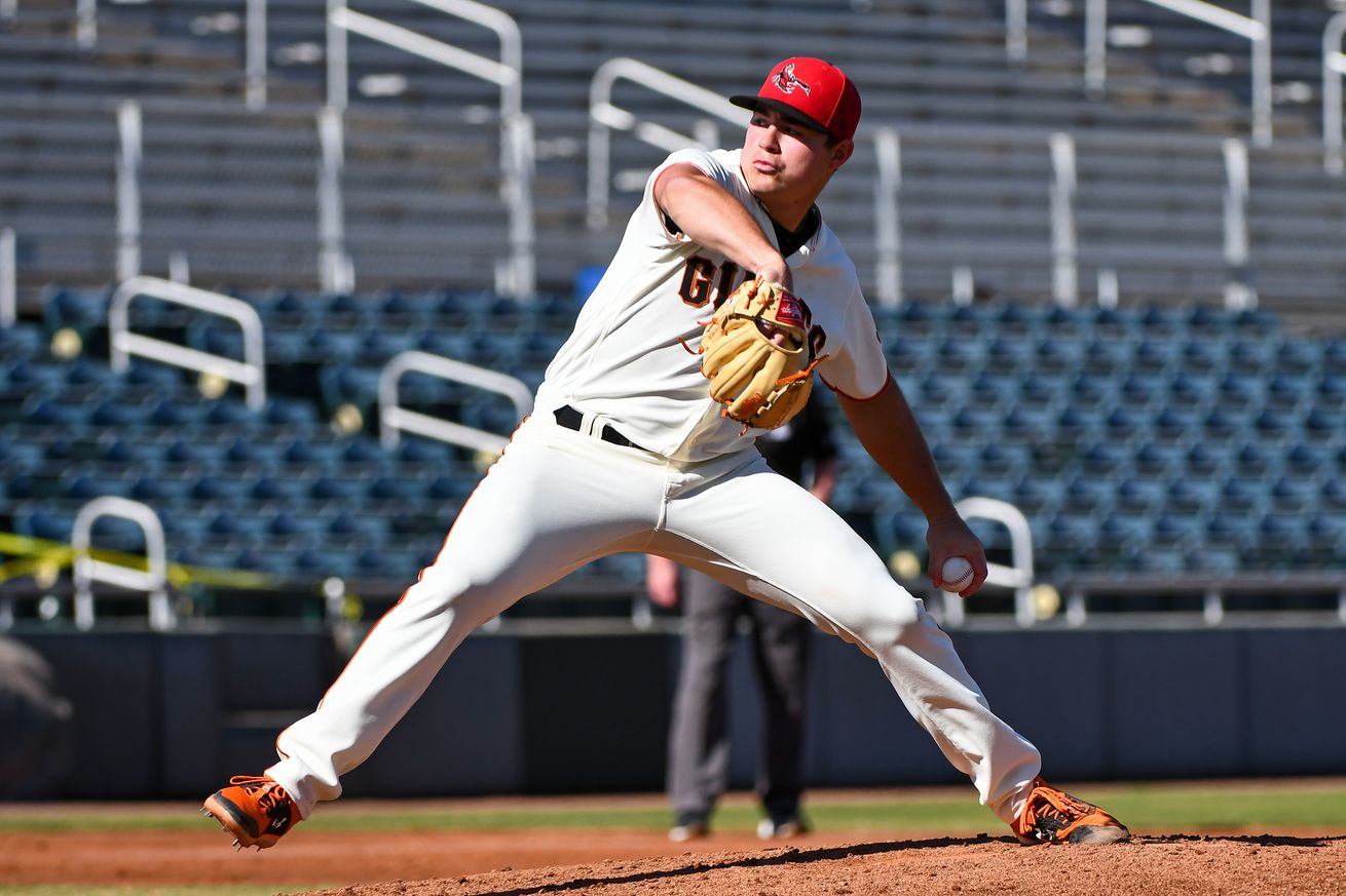 Seth Corry reaching back to throw a pitch