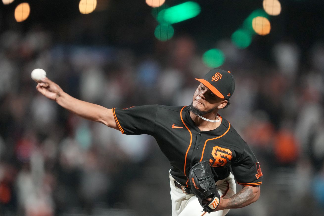 Camilo Doval throwing a pitch