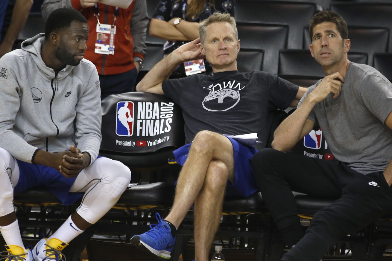 Draymond Green sits on the bench with head coach Steve Kerr and general manager Bob Myers during a Golden State Warriors practice at Oracle Arena in Oakland, Calif. on Wednesday, June 12, 2019 before Thursday’s Game 6 of the NBA Finals against the Toronto