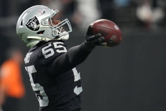 Dec 18, 2022; Paradise, Nevada, USA; Las Vegas Raiders defensive end Chandler Jones (55) runs an interception back for a touchdown against the New England Patriots at the end of the second half to give the Raiders a 30-24 win at Allegiant Stadium. Mandatory Credit: Stephen R. Sylvanie-USA TODAY Sports Chandler Jones, Raiders