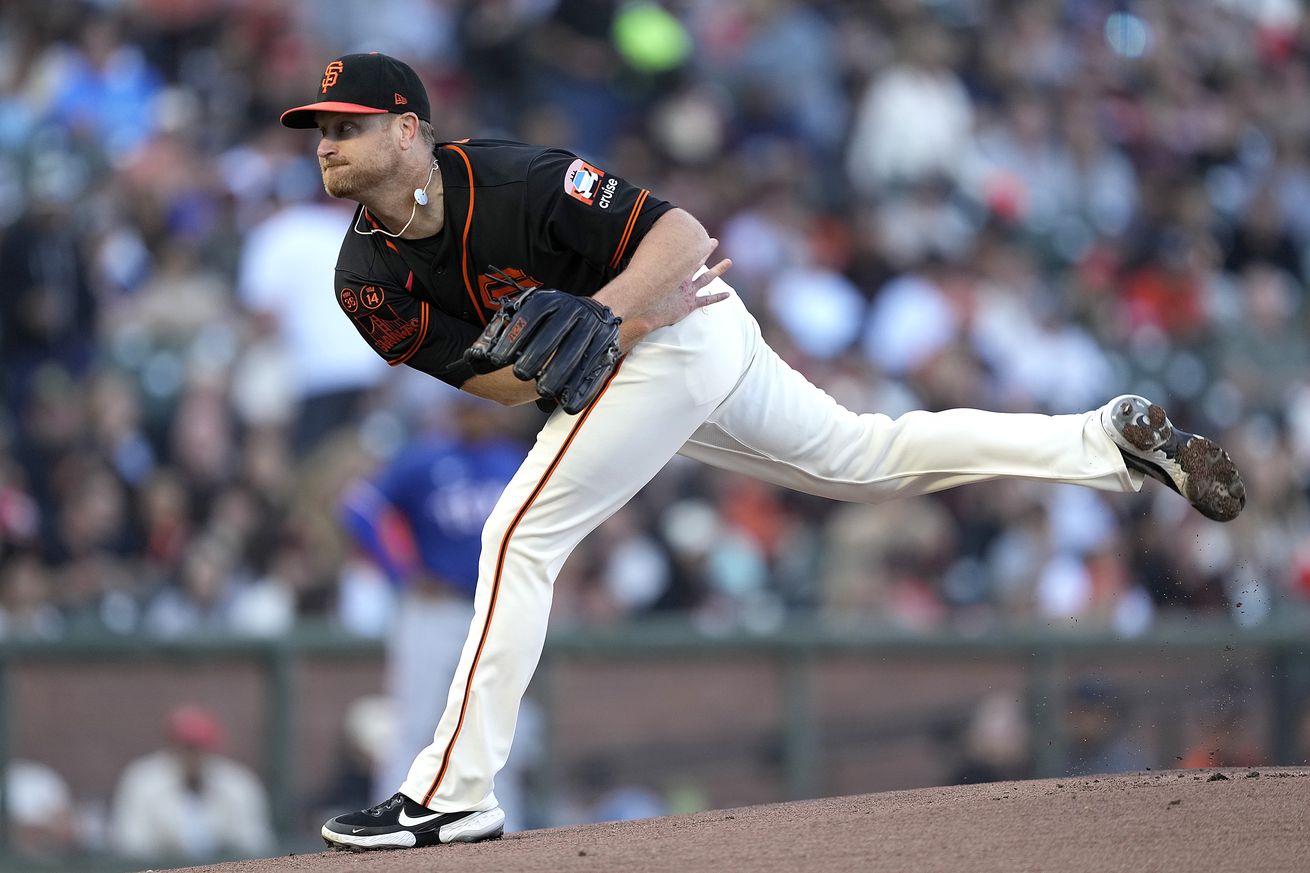 Side view of Alex Cobb finishing a pitch
