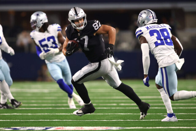 Aug 26, 2023; Arlington, Texas, USA; Las Vegas Raiders tight end Michael Mayer (87) runs the ball against Dallas Cowboys cornerback D'Angelo Mandell (38) in the second quarter at AT&T Stadium. Mandatory Credit: Tim Heitman-USA TODAY Sports Michael Mayer, Raiders