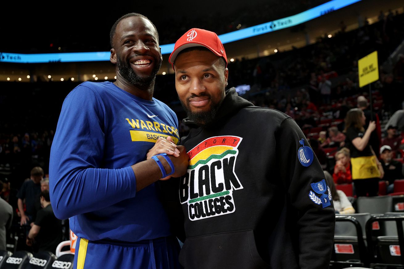 Draymond Green and Damian Lillard hugging