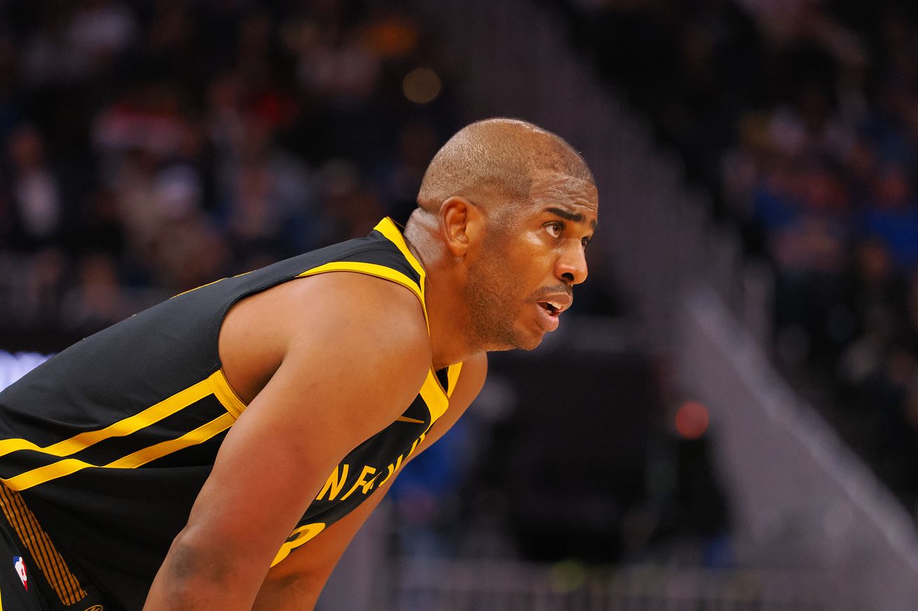 Chris Paul standing with his hands on his knees.