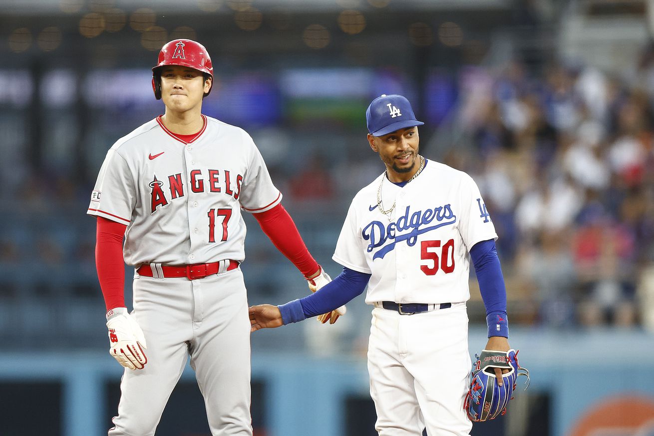 Shohei Ohtani standing on base with Mookie Betts.