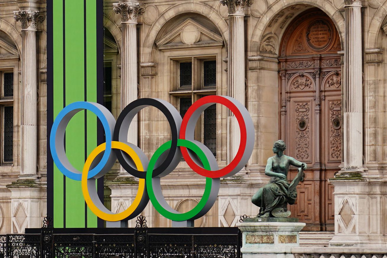 A large statue of the Olympic rings on display outside of the Hotel de Ville. The hotel’s architecture is elegant and gothic.