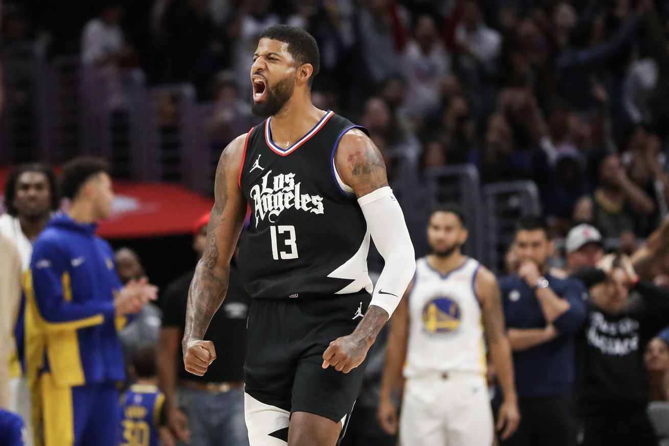 Paul George yelling in celebration.