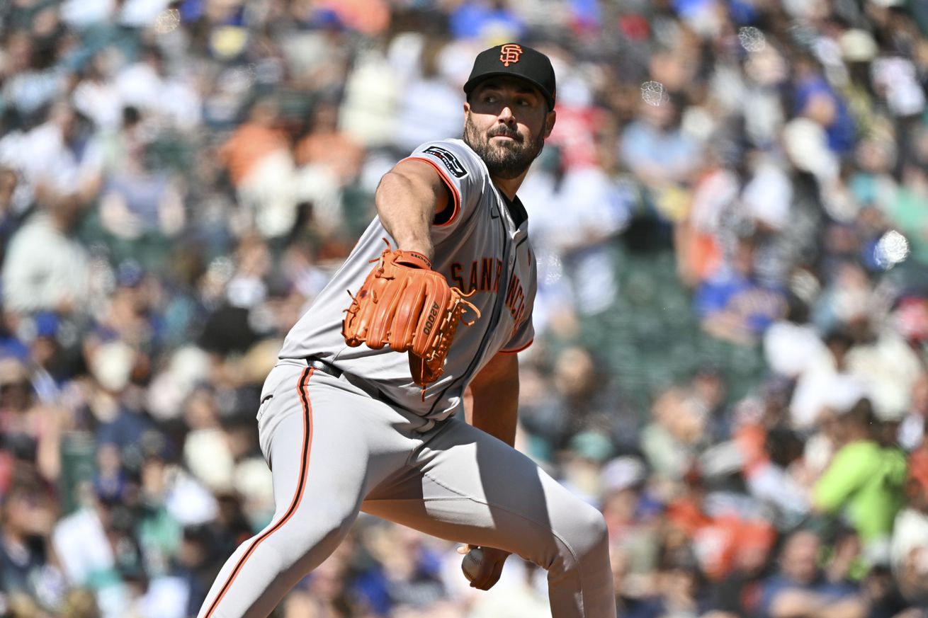 Robbie Ray reaching back to throw a pitch.  