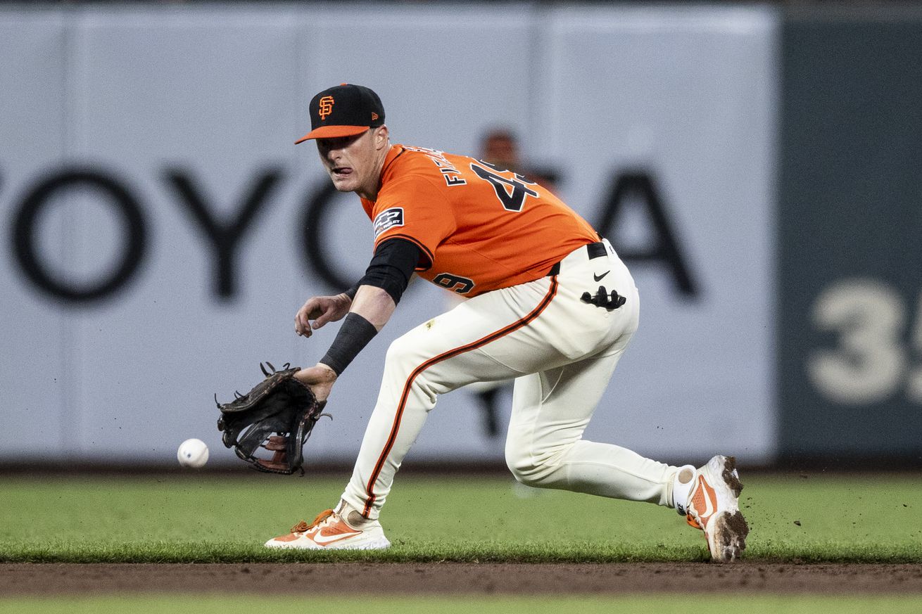 Tyler Fitzgerald reaching for a backhand groundball.
