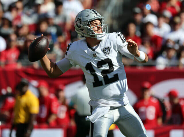 Dec 8, 2024; Tampa, Florida, USA; Las Vegas Raiders quarterback Aidan O'Connell (12) throws the ball during the first half against the Tampa Bay Buccaneers at Raymond James Stadium. Mandatory Credit: Kim Klement Neitzel-Imagn Images Aidan O'Connell, Raiders