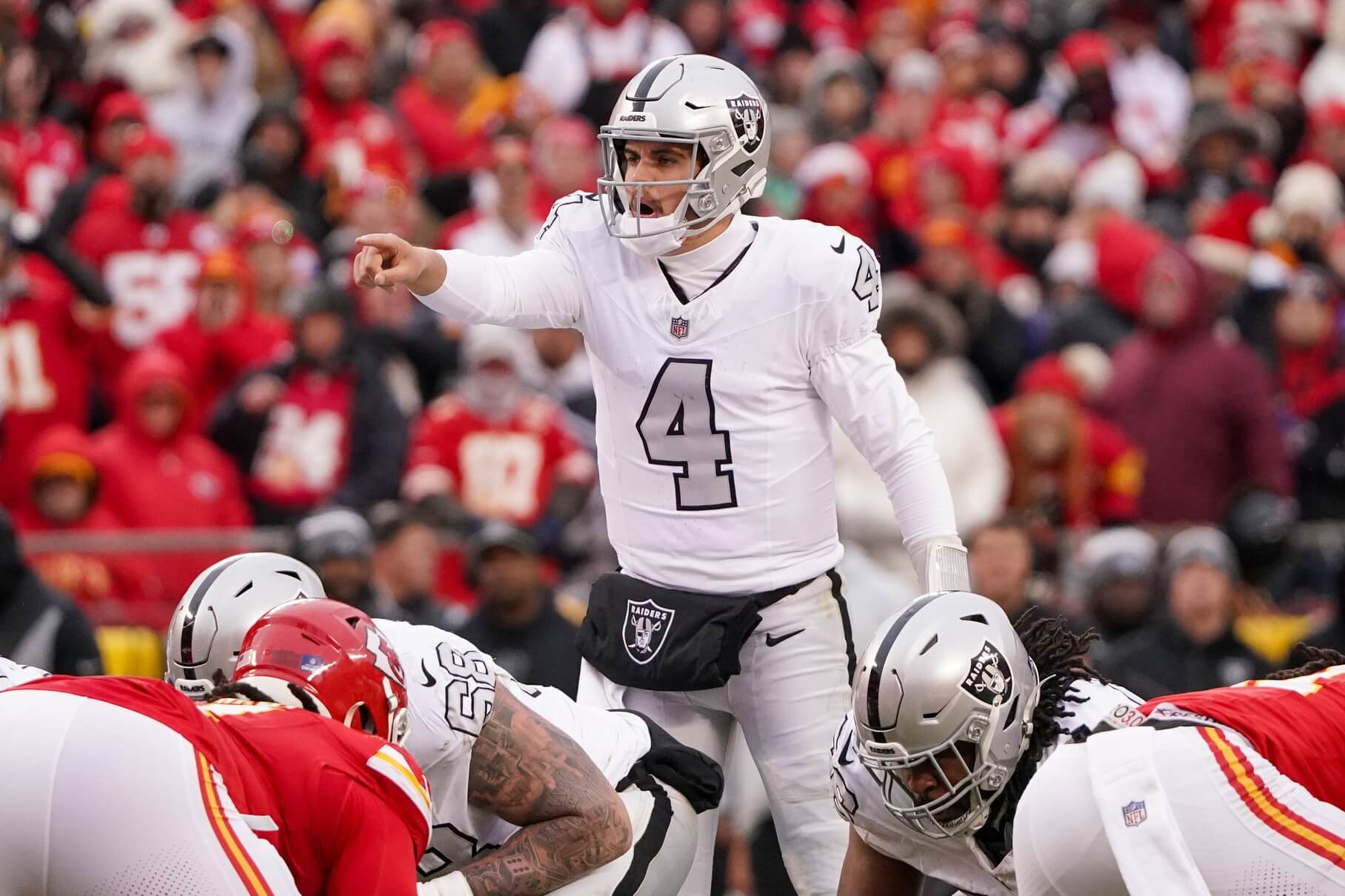 Dec 25, 2023; Kansas City, Missouri, USA; Las Vegas Raiders quarterback Aidan O'Connell (4) gestures at the line of scrimmage against the Kansas City Chiefs during the second half at GEHA Field at Arrowhead Stadium. Mandatory Credit: Denny Medley-USA TODAY Sports Aidan O'Connell, Raiders, Chiefs