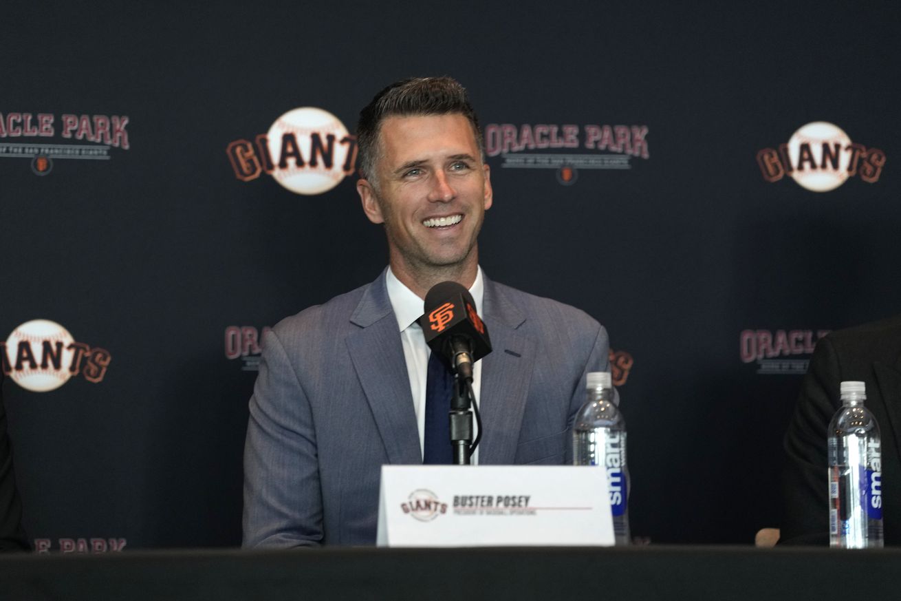 Buster Posey laughing at a press conference.