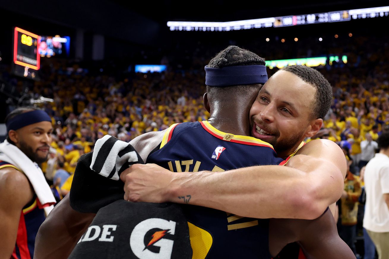 Close up of Steph curry hugging Jimmy Butler III after a playoff win.