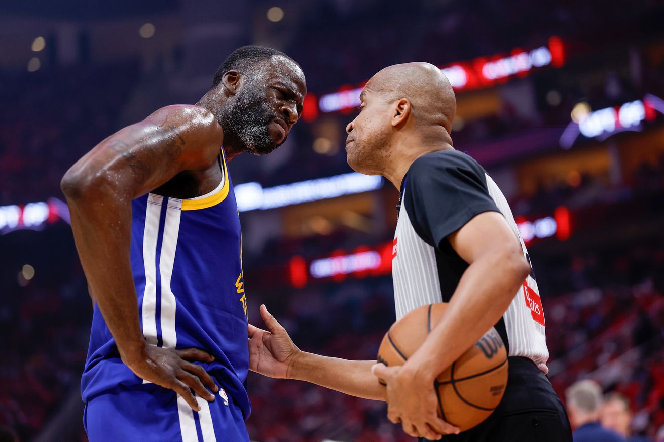 Close up of Draymond Green talking animatedly with a ref.
