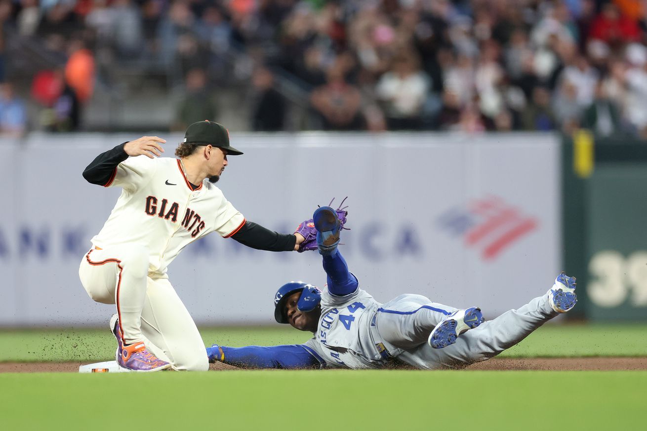 Willy Adames tagging Dairon Blanco as he slides into second base.
