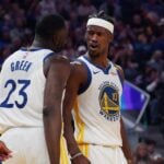Golden State Warriors forward Jimmy Butler III (10) celebrates with forward Draymond Green