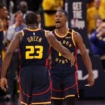 Golden State Warriors forward Draymond Green (23) celebrates with forward Jimmy Butler III