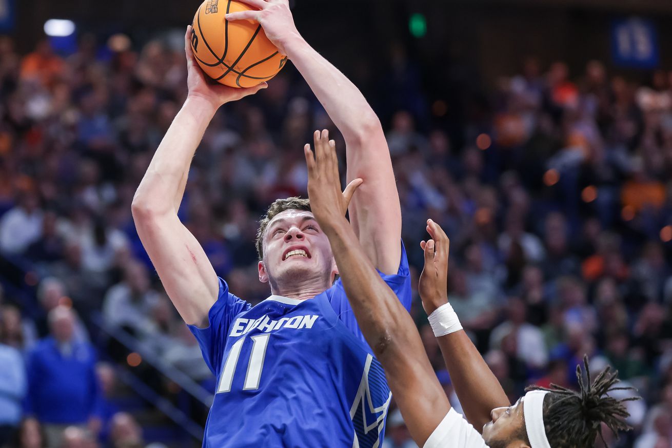 Ryan Kalkbrenner grimacing while shooting a shot.