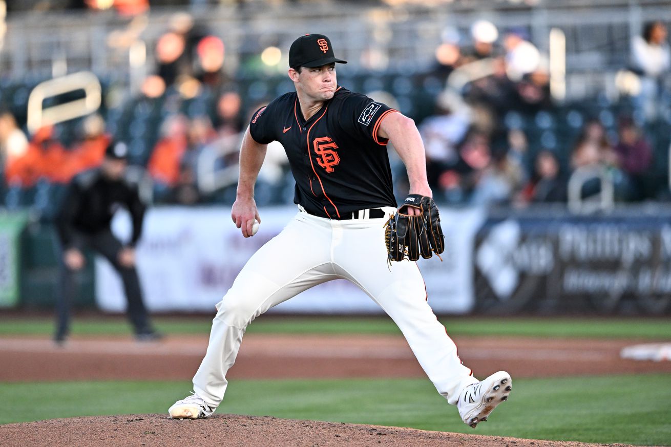 Side view of Carson Seymour throwing a pitch.
