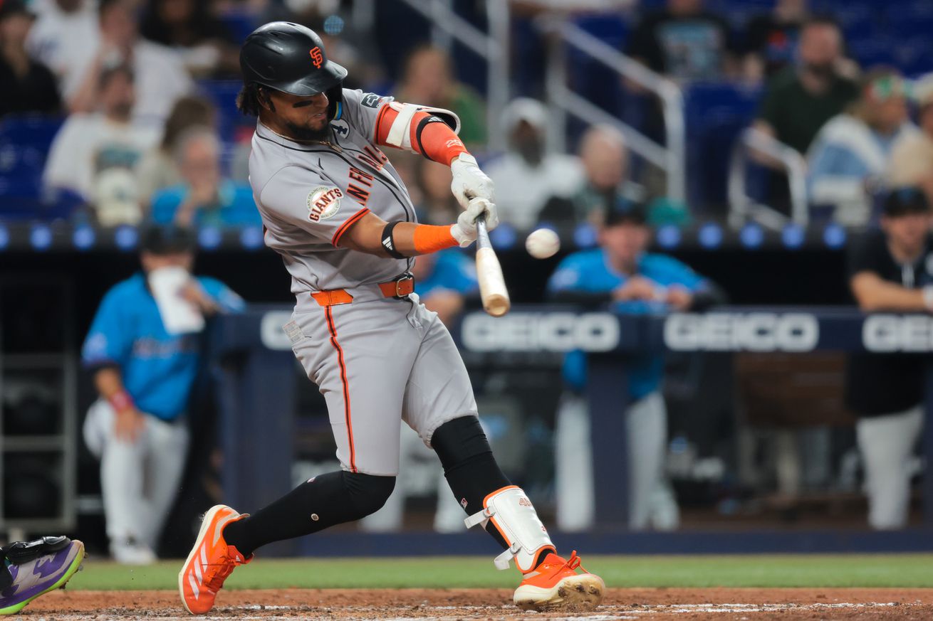 Side view of Luis Matos swinging at a pitch.