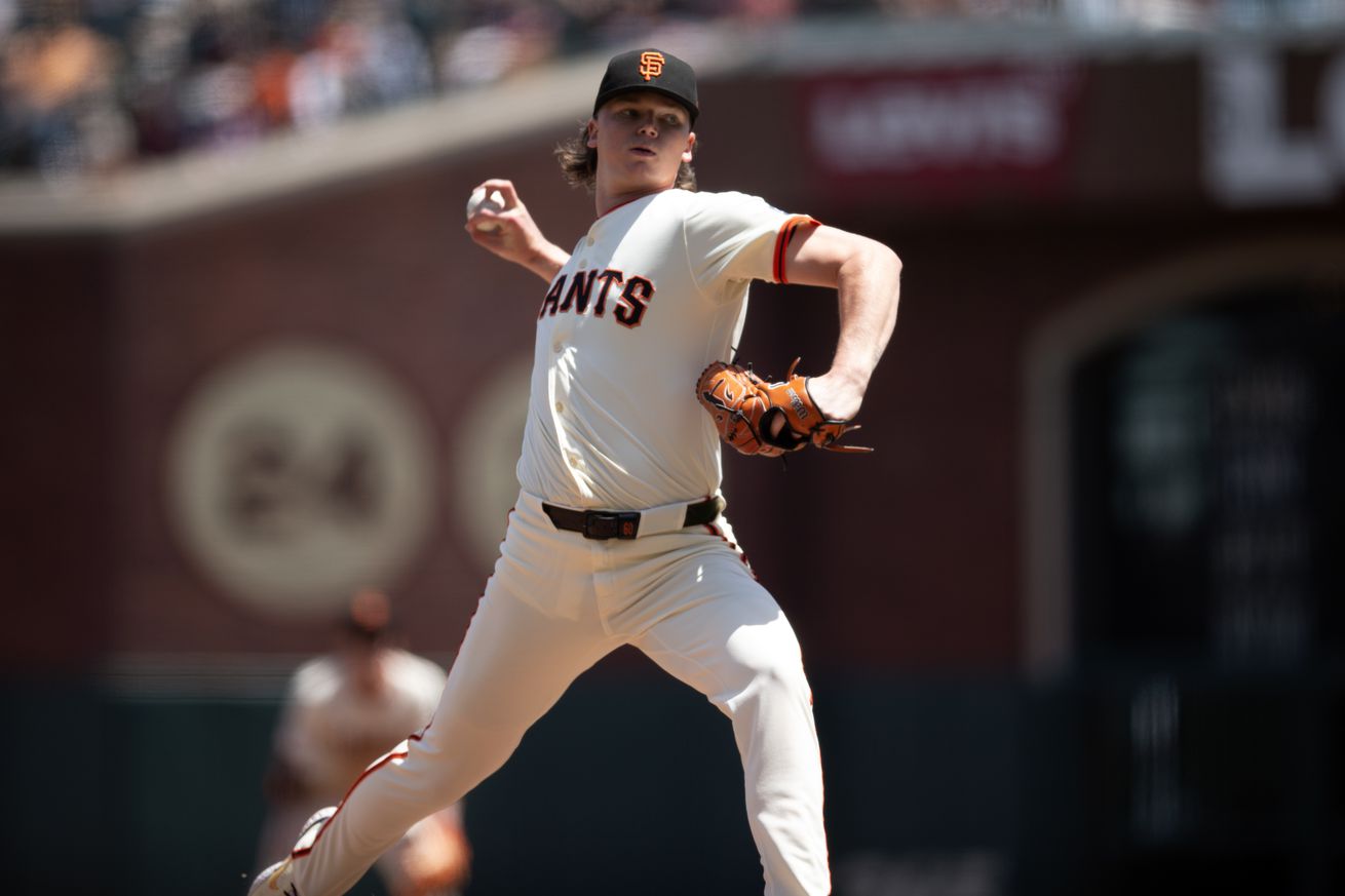 Hayden Birdsong reaching back to throw a pitch.