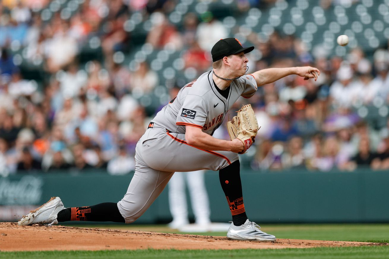 Side view of Kyle Harrison throwing a pitch