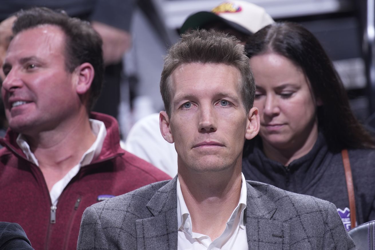 Mike Dunleavy Jr. sitting in the stands, staring blankly.