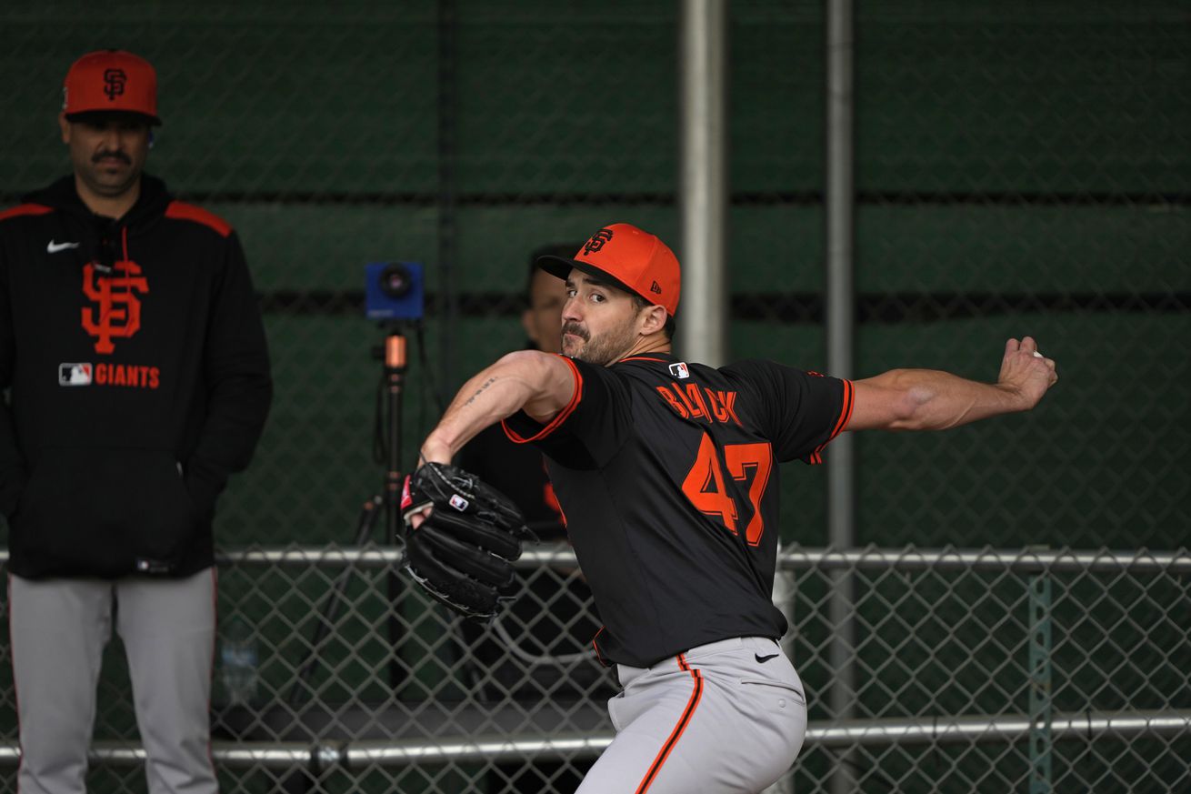 Mason Black reaching back to throw a pitch during Spring Training. 