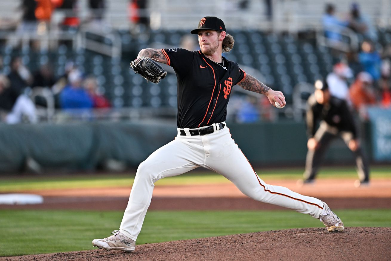 Carson Whisenhunt reaching back to throw a pitch.