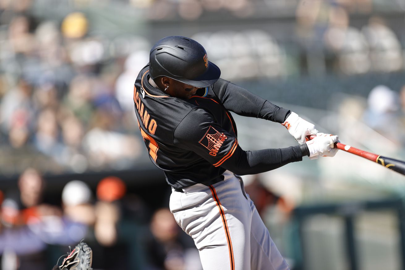 Marco Luciano swinging at a pitch.