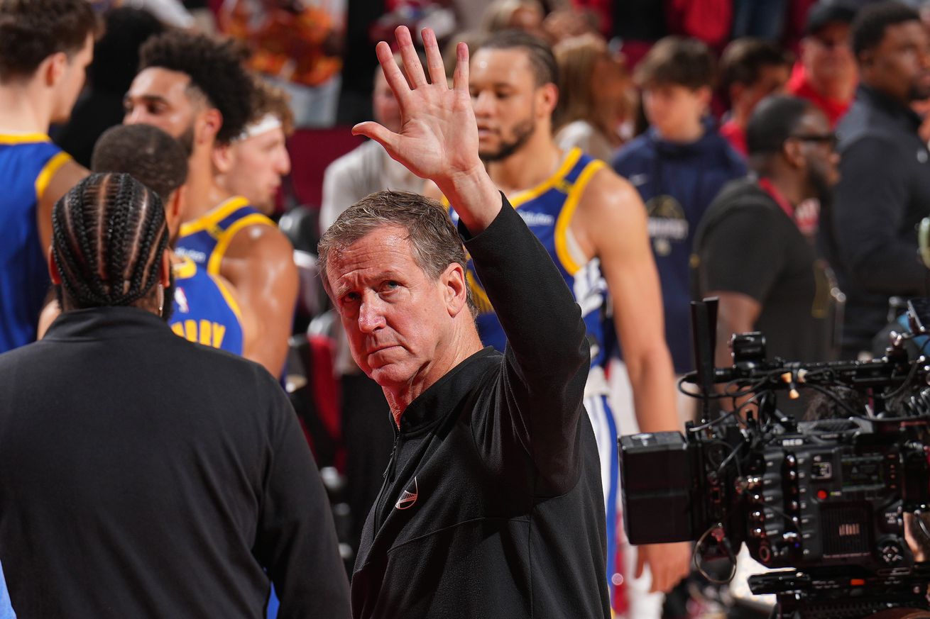 Terry Stotts waving to fans.