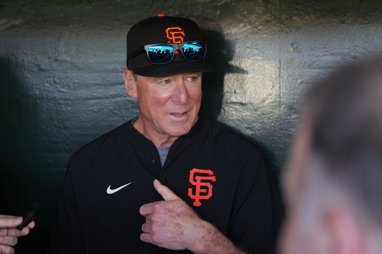 Bob Melvin in the clubhouse talking to reporters.