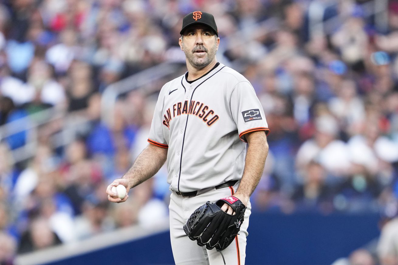 Justin Verlander standing on the mound, holding a baseball.