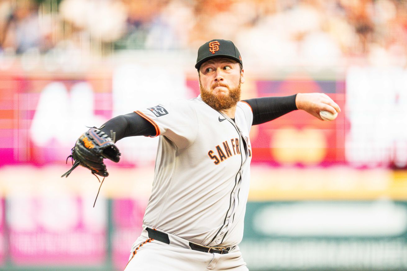 Close up of Matt Gage throwing a pitch.