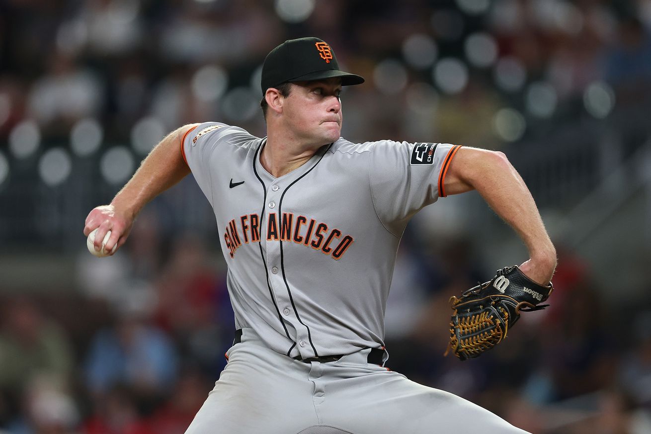 Side view of Carson Seymour throwing a pitch. 