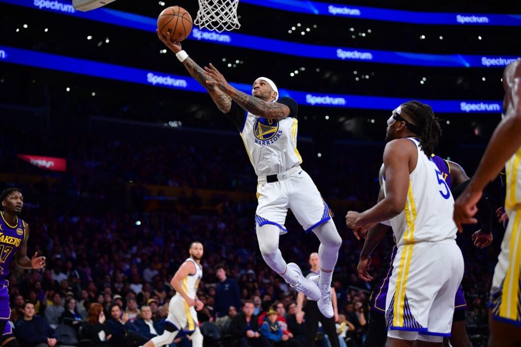 Feb 6, 2025; Los Angeles, California, USA; Golden State Warriors guard Gary Payton II (0) moves to the basket against the Los Angeles Lakers during the second half at Crypto.com Arena. Mandatory Credit: Gary A. Vasquez-Imagn Images