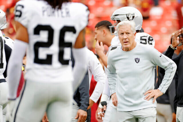 Sep 21, 2025; Landover, Maryland, USA; The Las Vegas Raiders head coach Pete Carroll huddles with the team before the game against the Washington Commanders at Northwest Stadium. Mandatory Credit: Amber Searls-Imagn Images Pete Carroll, Las Vegas Raiders
