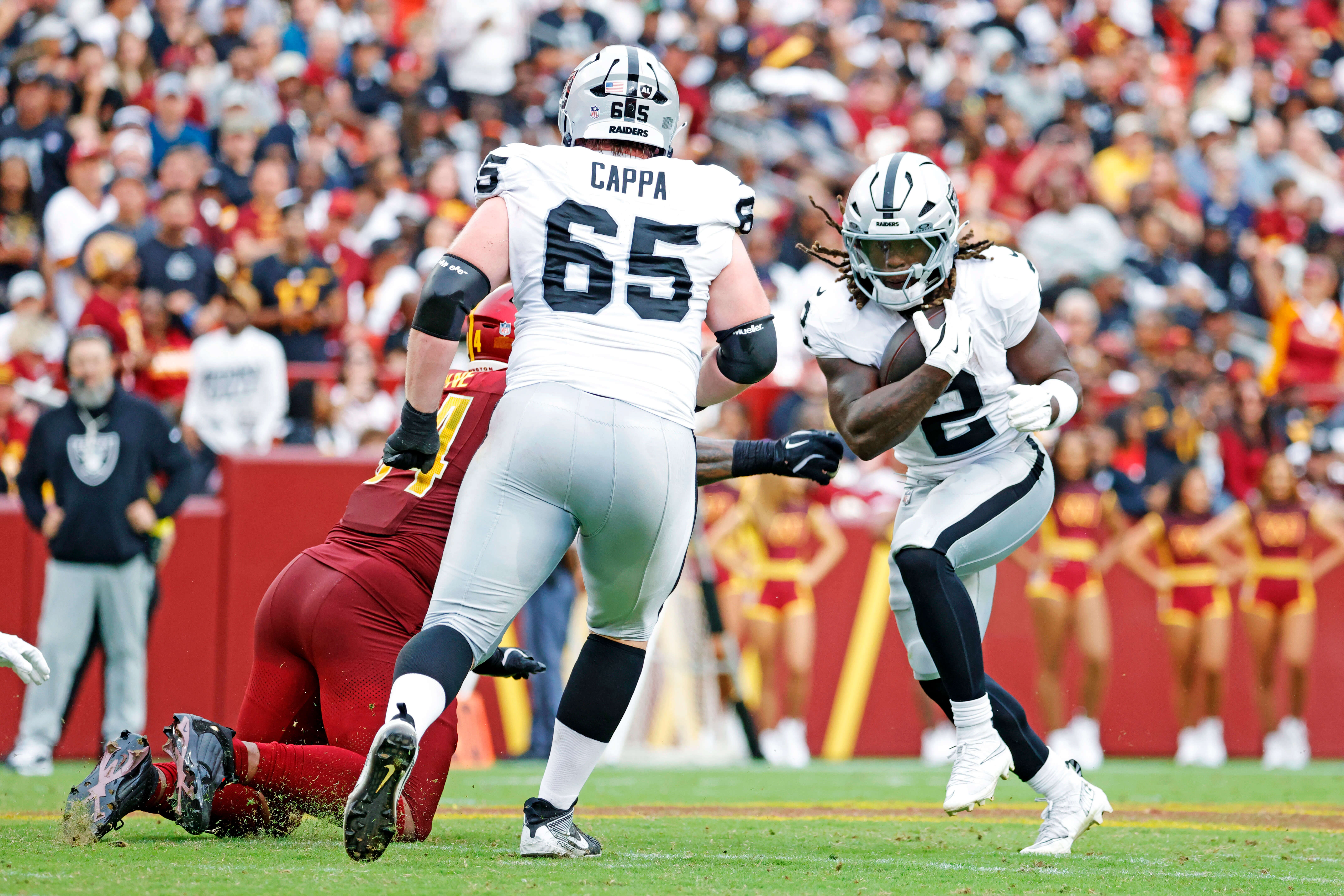Sep 21, 2025; Landover, Maryland, USA; Las Vegas Raiders running back Ashton Jeanty (2) runs the ball during the second half against the Washington Commanders at Northwest Stadium. Mandatory Credit: Amber Searls-Imagn Images Ashton Jeanty, Raiders