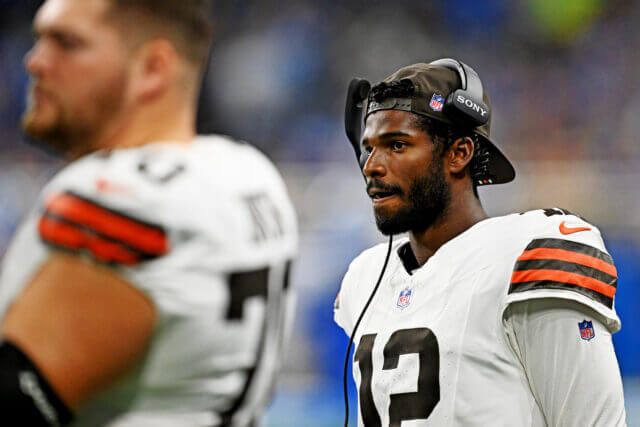 Sep 28, 2025; Detroit, Michigan, USA; Cleveland Browns quarterback Shedeur Sanders (12) looks on from he sidelines during the second half against the Detroit Lions at Ford Field. Mandatory Credit: Lon Horwedel-Imagn Images Shedeur Sanders, Browns, Raiders
