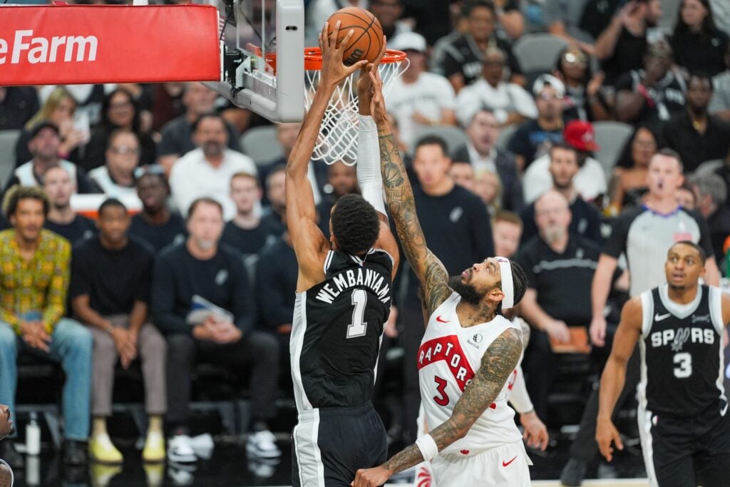 Oct 27, 2025; San Antonio, Texas, USA; San Antonio Spurs forward/center Victor Wembanyama (1) shoots in front of Toronto Raptors forward Brandon Ingram (3) in the second half at Frost Bank Center. Mandatory Credit: Daniel Dunn-Imagn Images