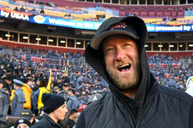 Dec 14, 2024; Landover, Maryland, USA; Dave Portnoy, Bar Stool Sports founder and owner walks along the sidelines before the playing of the 125 Army Navy game at Commanders Field. Mandatory Credit: Tommy Gilligan-Imagn Images
Dec 14, 2024; Landover, Maryland, USA; Dave Portnoy poses with solders before the between the Army Black Knights and the Navy Midshipmen at Commanders Field. Mandatory Credit: Tommy Gilligan-Imagn Images Dave Portnoy, Raiders