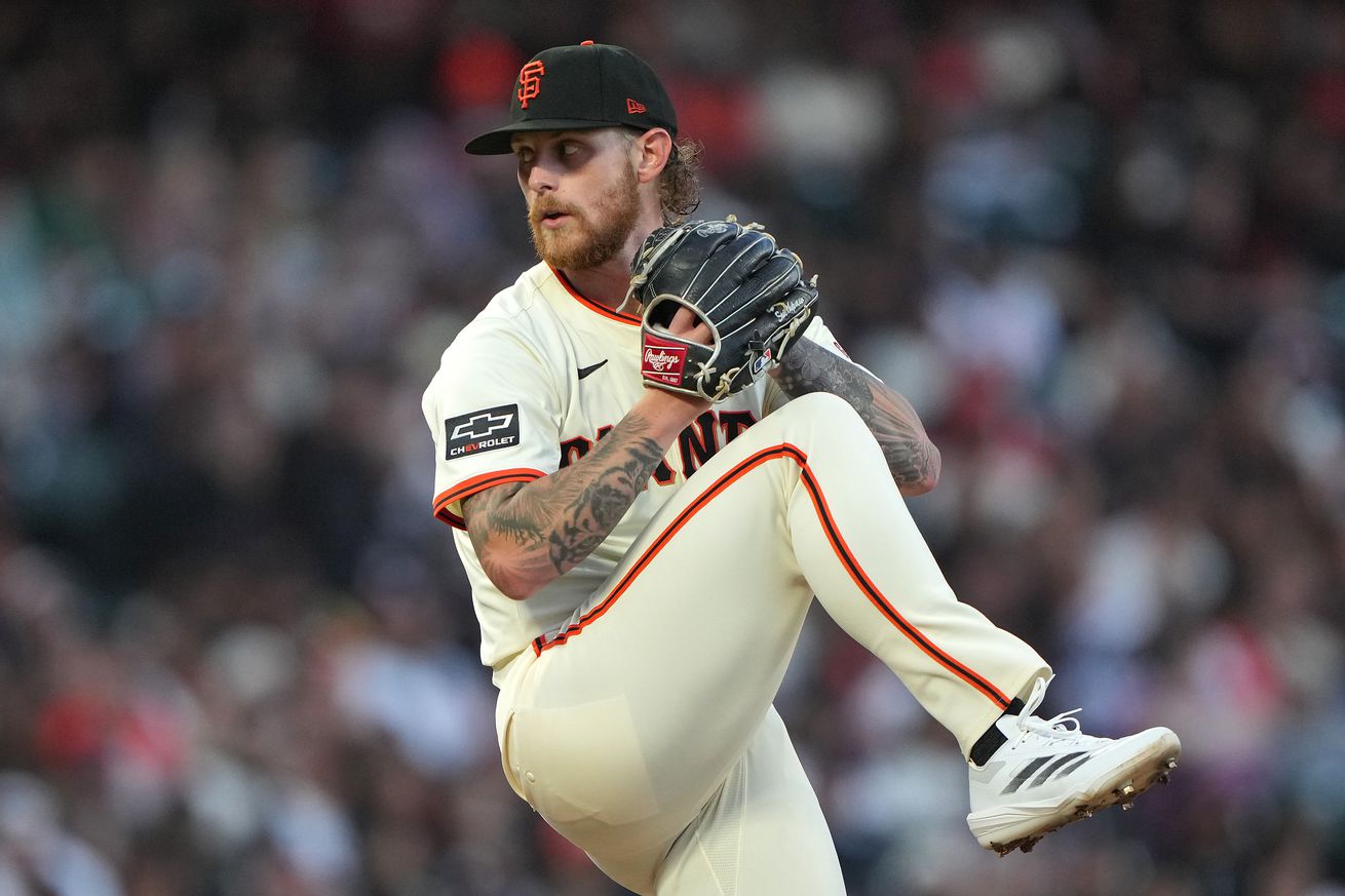 Side view of Carson Whisenhunt lifting his leg before throwing a pitch. 