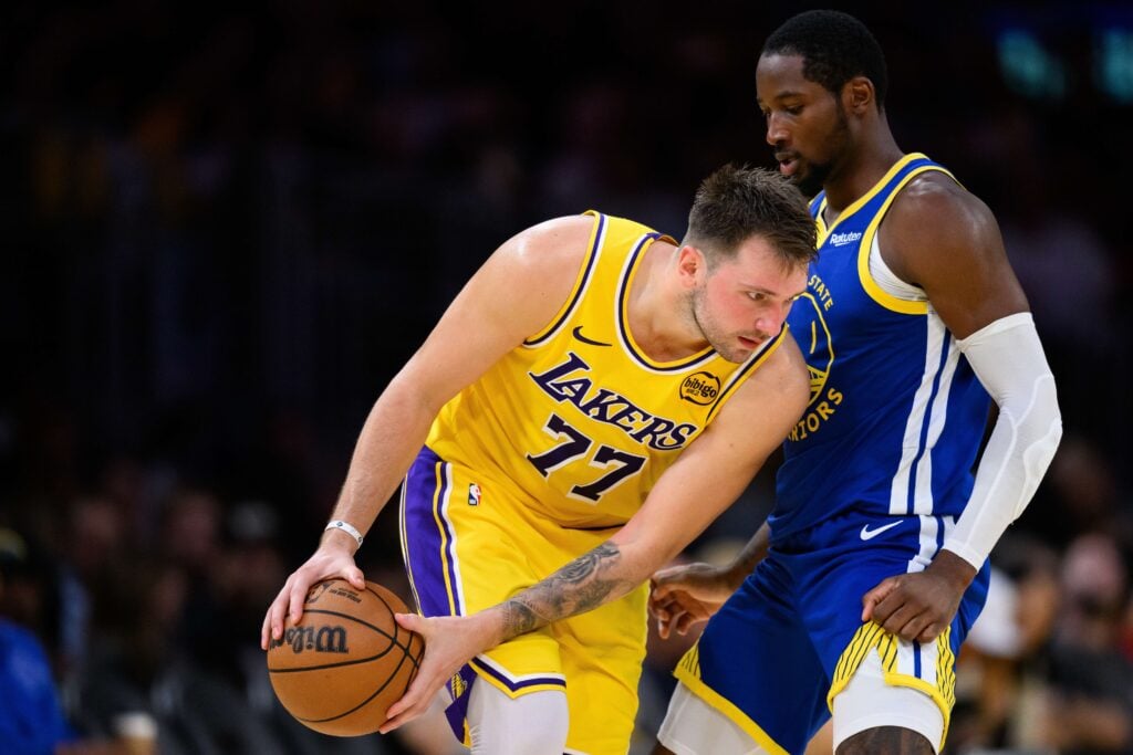 Golden State Warriors forward Jonathan Kuminga guards Los Angeles Lakers guard Luka Doncic