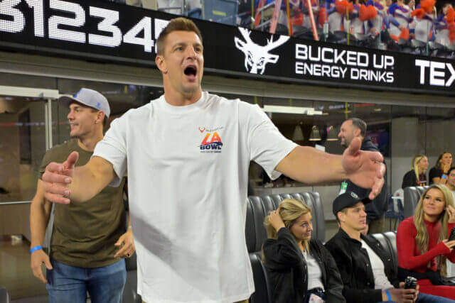 Dec 13, 2025; Inglewood, CA, USA; Rob Gronkowski watches the LA bowl between the Boise State Broncos and the Washington Huskies at SoFi Stadium. Mandatory Credit: Jayne Kamin-Oncea-Imagn Images Rob Gronkowski, Raiders